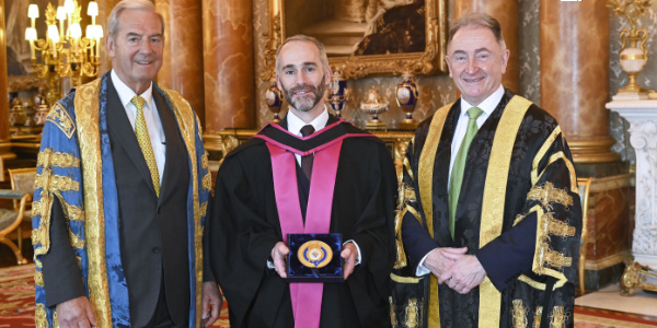 Lord Smith, Professor Keith Mathieson and Professor Sir Jim McDonald with the Queen's Anniversary Prize medal.