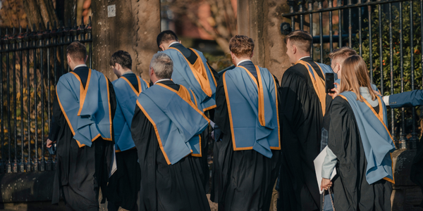 Graduates walking in their academic gowns