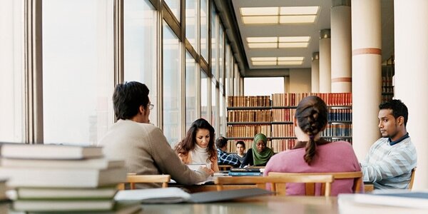 Group of students study in library