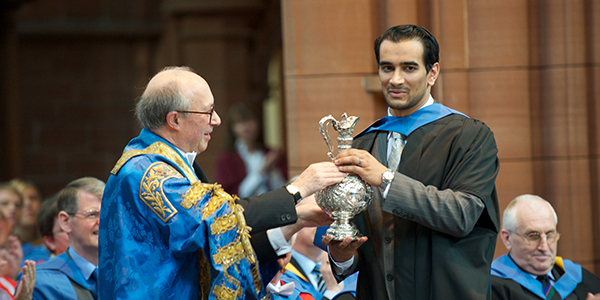 Azeem Ibrahim receiving his 2012 Alumni of the Year Award