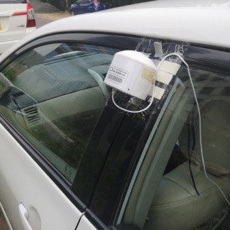 Instrument attached to car for mobile measurements throughout Kolkata