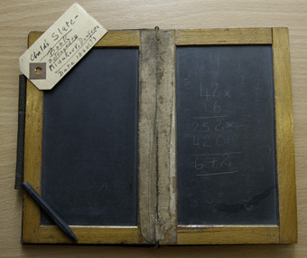 Slate with slate pencil, c1860.