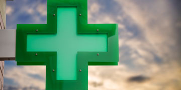 the green cross pharmacy sign