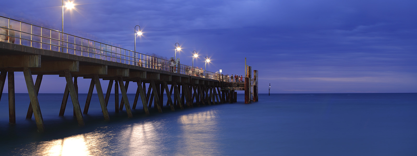 A pier bathed in light