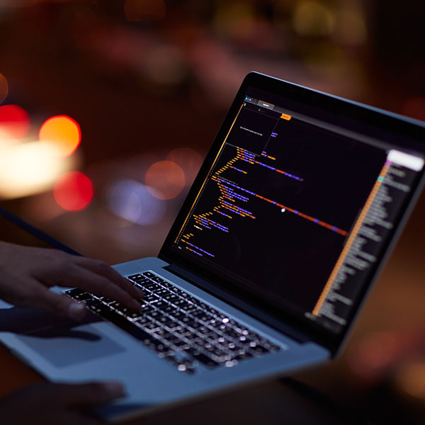 A person using a laptop computer A person using a laptop computer