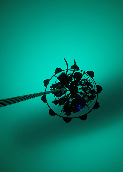 An underwater photo of an optic profiler measuring phytoplankton levels in the Arctic