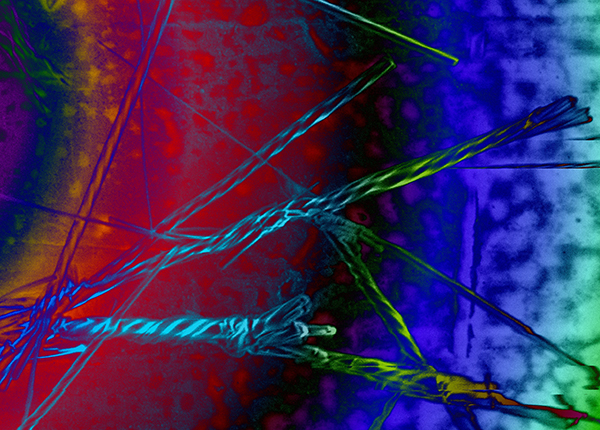 A colourful microscope image showing twisting crystals of the drug oxcarbazepine