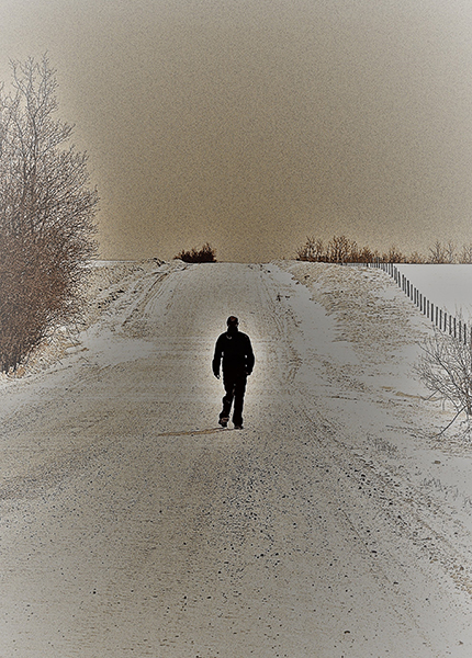 A bleak scene showing a man walking off into the distance on a long path