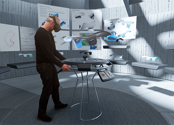 A man with a VR headset stands in a VR environment, viewing a 3D product design with design drawings in the background