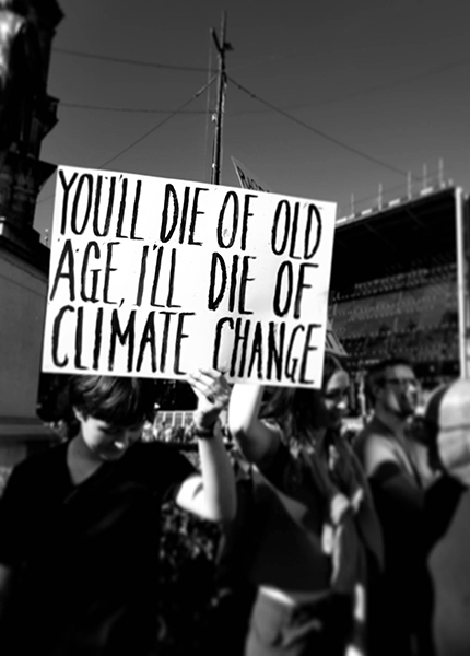 A black and white photo of protesters at a climate change protest 
