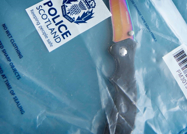 ): A knife in a sealed police evidence bag