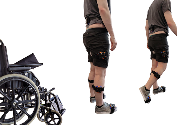 A wheelchair, followed by a person standing, followed by a person walking away