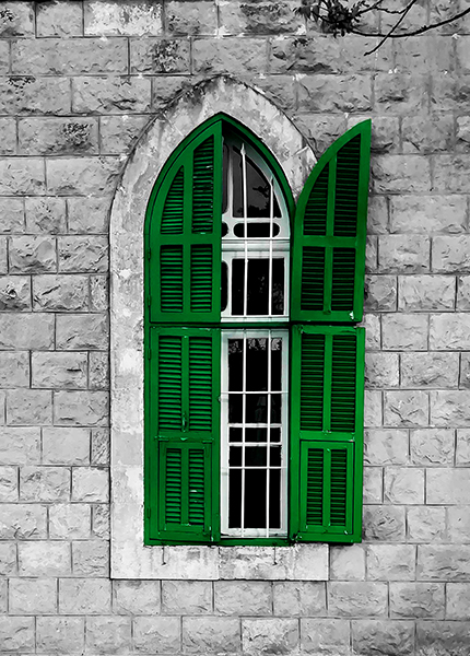 A close-up of a window with green shutters, one open