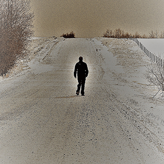 A bleak scene showing a man walking off into the distance on a long path