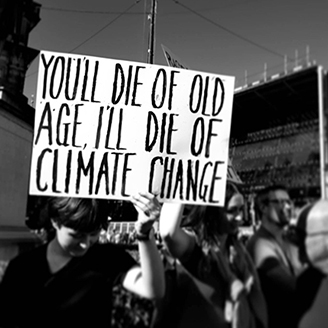 A black and white photo of protesters at a climate change protest 