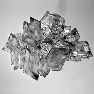 A black and white image of a crystal formation