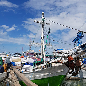 An Indonesian fishing boat moored in a marina