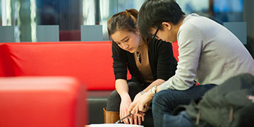 Interior of business school with students.