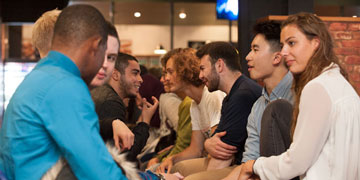 a group of students sit together in discussion