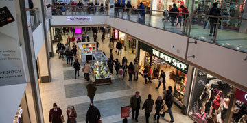 internal shot of the st enoch's centre, indoor stores with people walking by