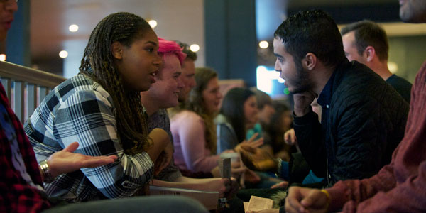 students sitting chatting at a speed meeting event students sitting chatting at a speed meeting event