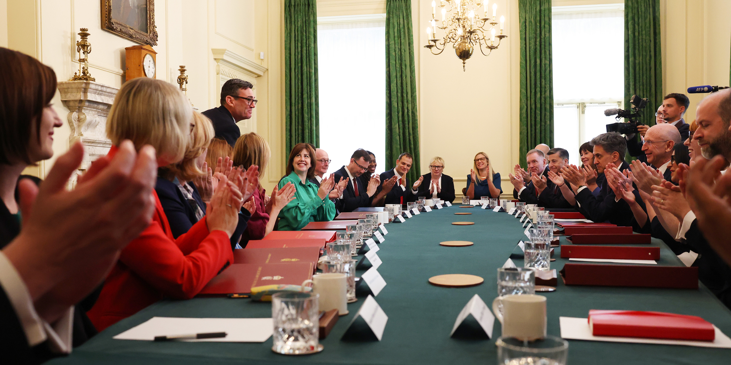 Andy Burnham is applauded by his new cabinet sitting in session