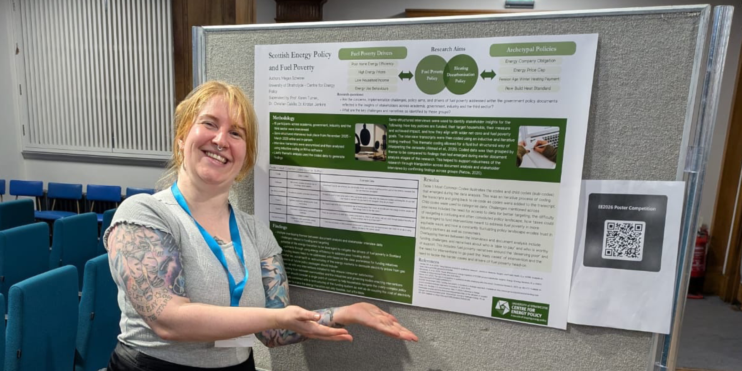 PhD student Megan Scherrer standing next to their poster presentation