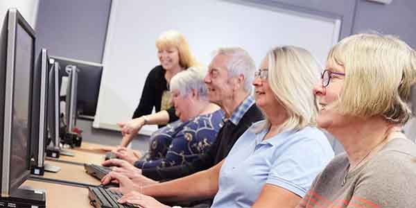 Mature students using computers