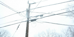 Power lines covered in snow