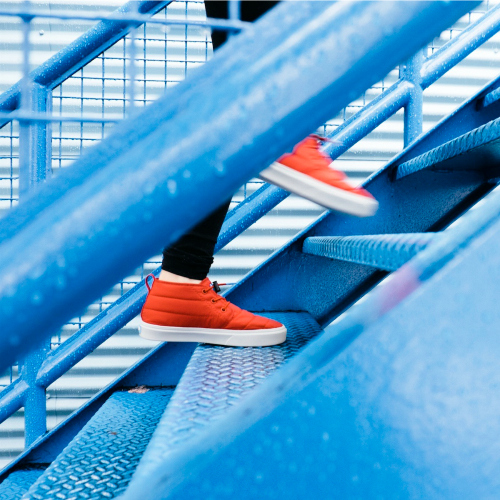 Woman's feet going up stairs