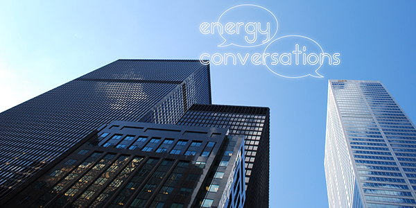 Two skyscrapers against the sky with the Energy Conversations logo superimposed