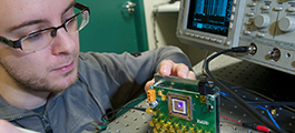 Researcher testing a micro LED array 