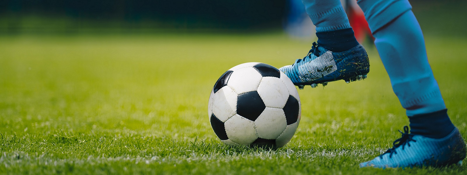 Football on a grass pitch
