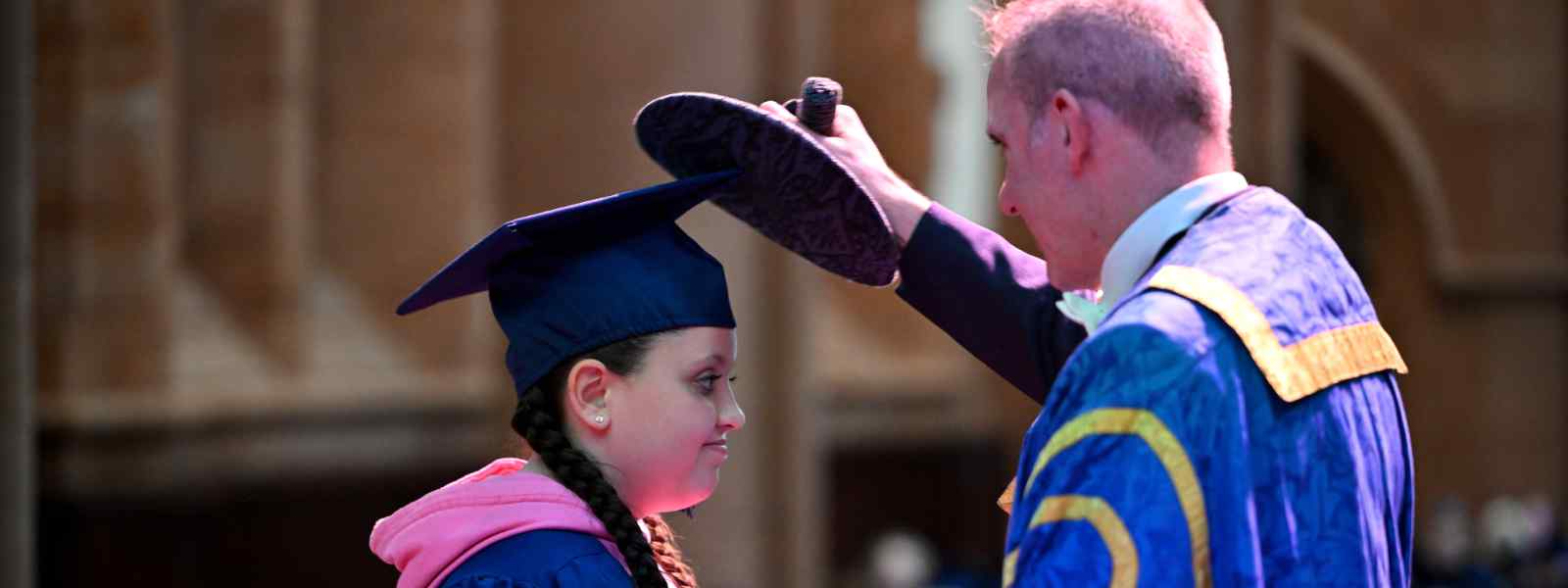 A Young Strathclyder 'graduate' is capped by Principal and Vice-Chancellor Professor Stephen McArthur. Photo by Mark Runnacles