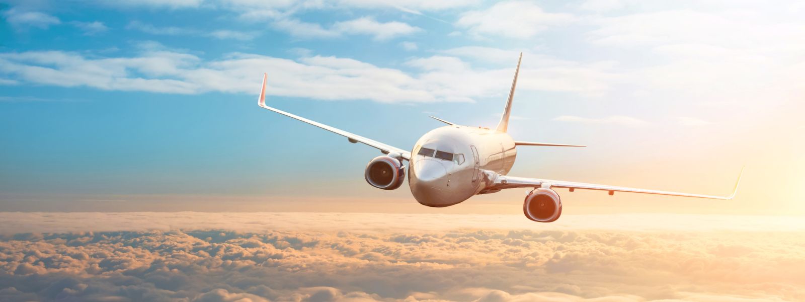 Twin-engined passenger jet flying in the sky Twin-engined passenger jet flying in the sky
