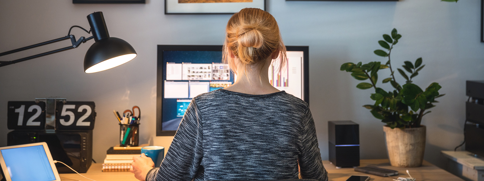 Back of a woman sitting at computer Back of a woman sitting at computer