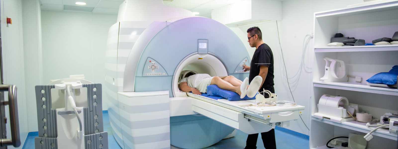 Nurse with a patient inside an MRI machine