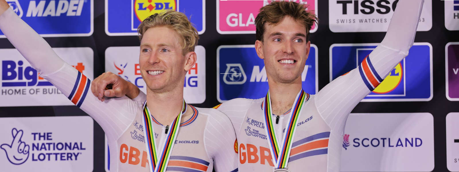Mark Stewart and Oliver Wood with silver medals around their necks.
