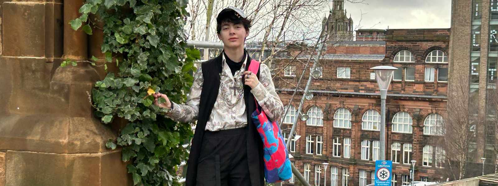 Michael Archibald on the Strathclyde campus with the bag he designed for John Lewis