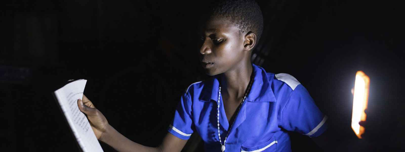 Ntandamula pupil studying after nightfall thanks to the EASE project