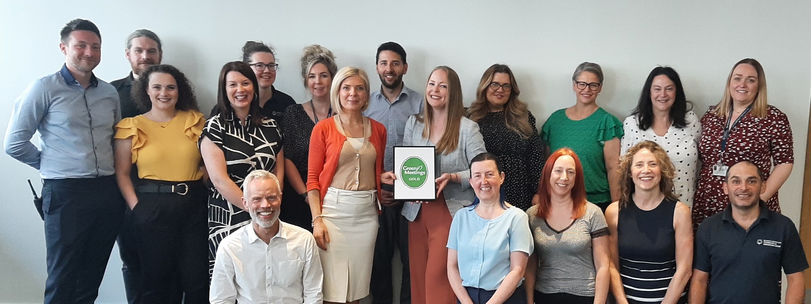 The Conferencing and Events Team holding the Green Meetings Gold award