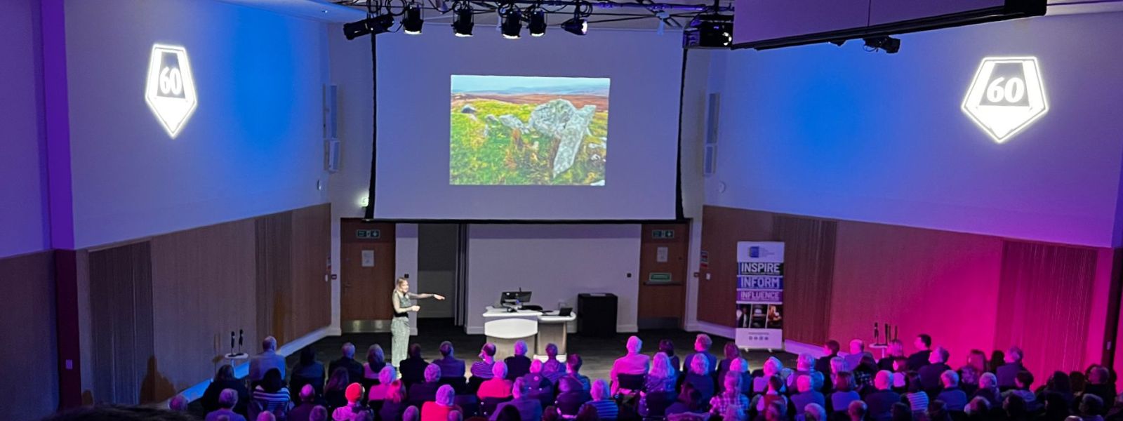 An audience watches Professor Alice Roberts' lecture in the Main Auditorium of the Technology and Innovation Centre
