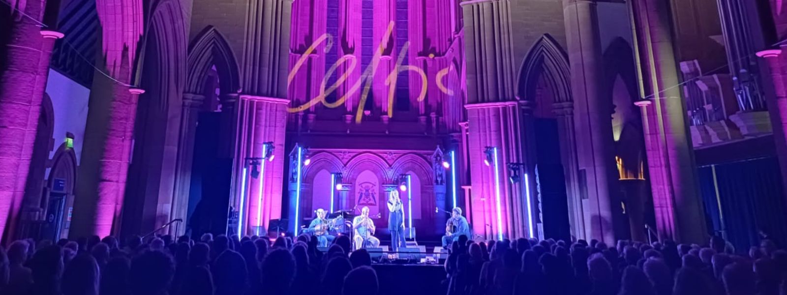 An audience watches a Celtic Connections concert in the Great Hall of the Barony