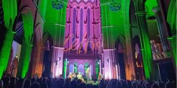 An audience watches a Celtic Connections concert in the Great Hall of the Barony