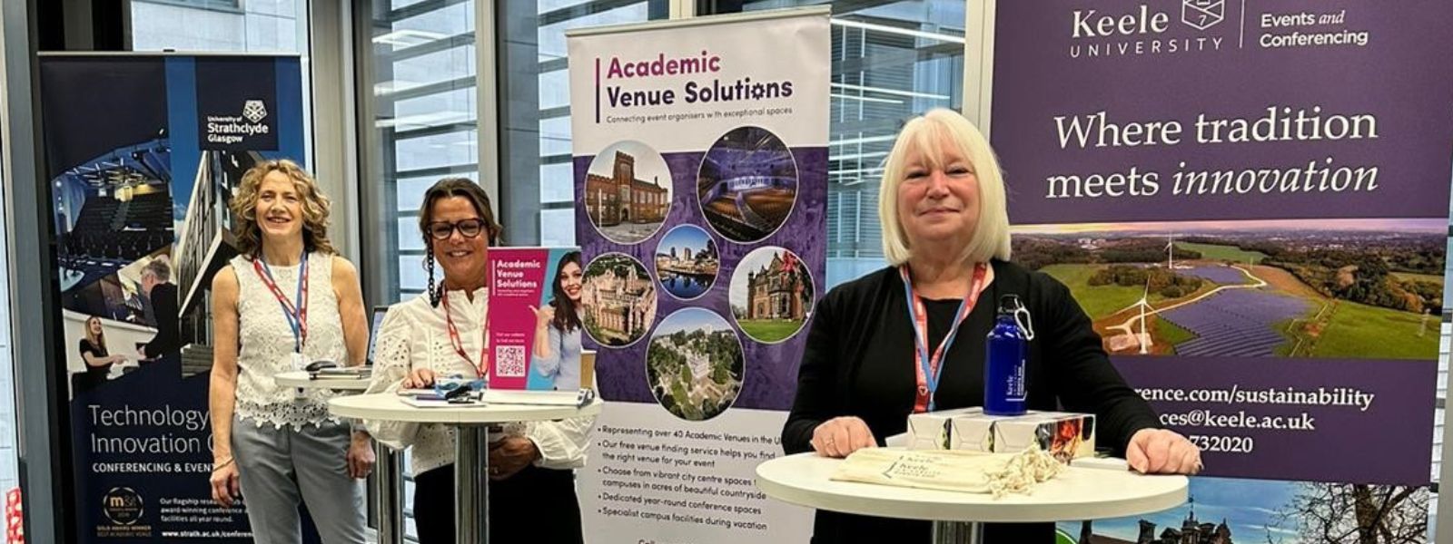 Exhibitors attending the Sustainability Show, standing at poseur tables