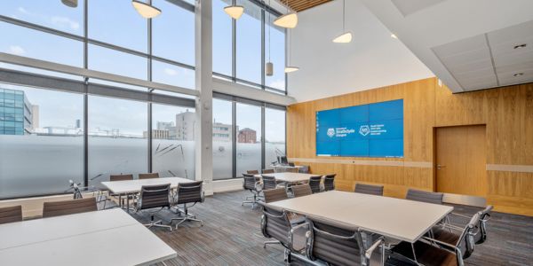 Executive Suite set cabaret style, facing the videowall. Photo: Lucy Knott