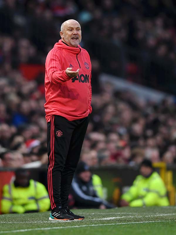 Mike Phelan on the touchline at Old Trafford.