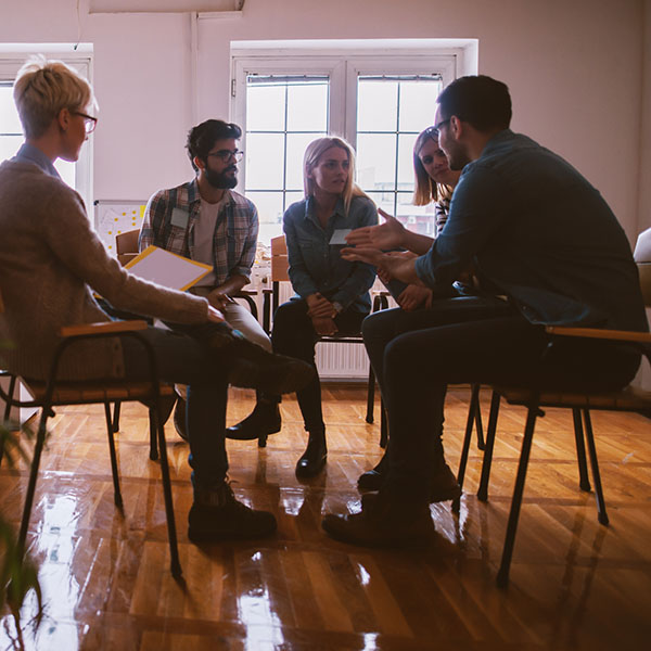 Seated  group of young people having a discussion