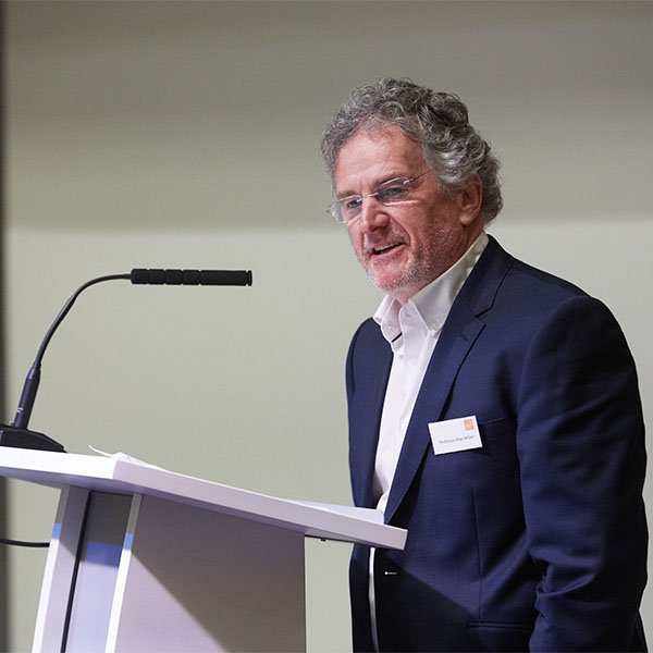 Professor Alan Miller speaking at a lectern