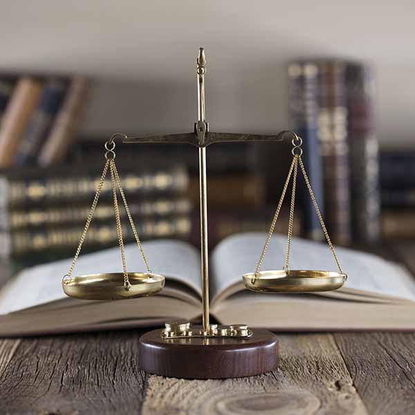 Law scales with open book